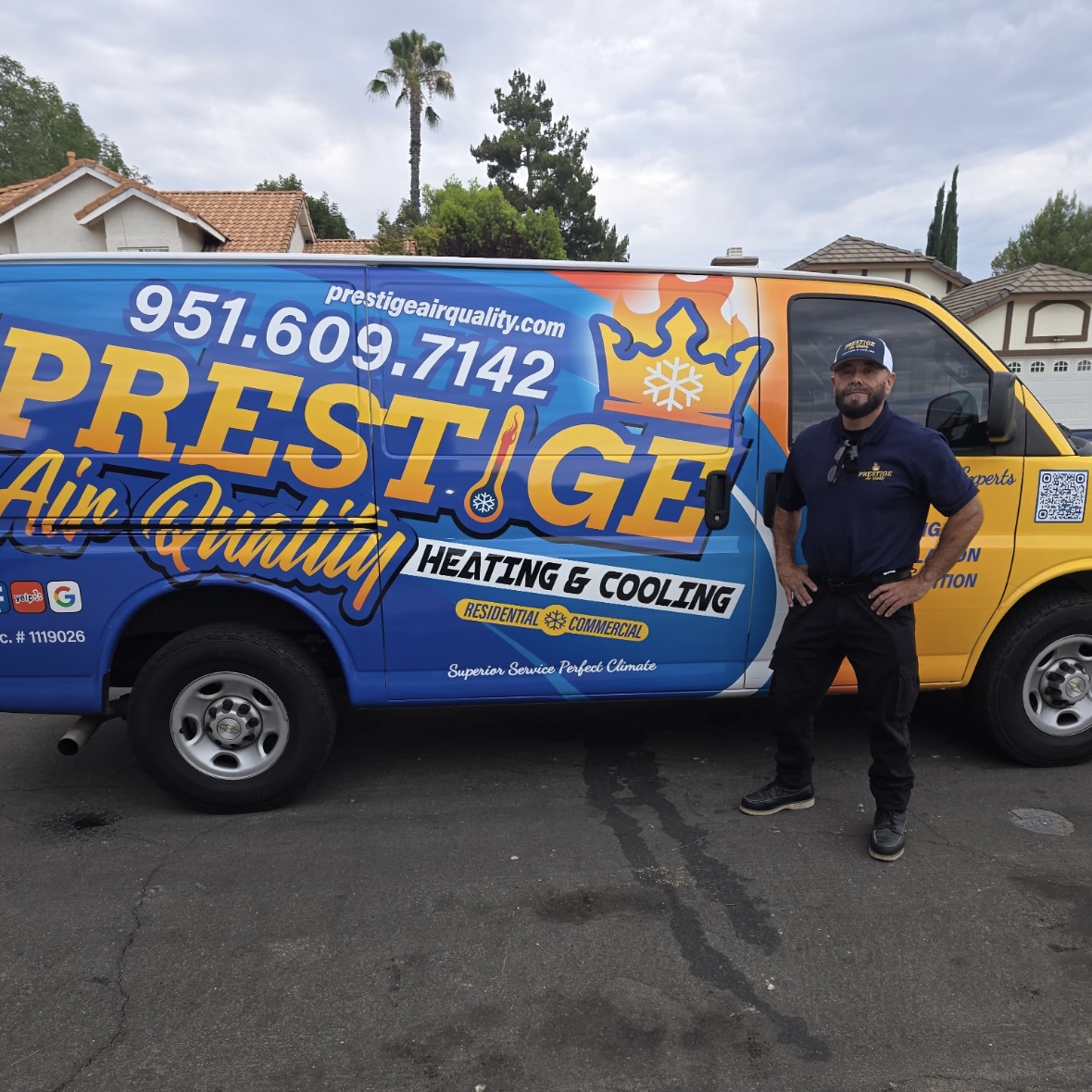 Ramon next to the Prestige Air Quality service van